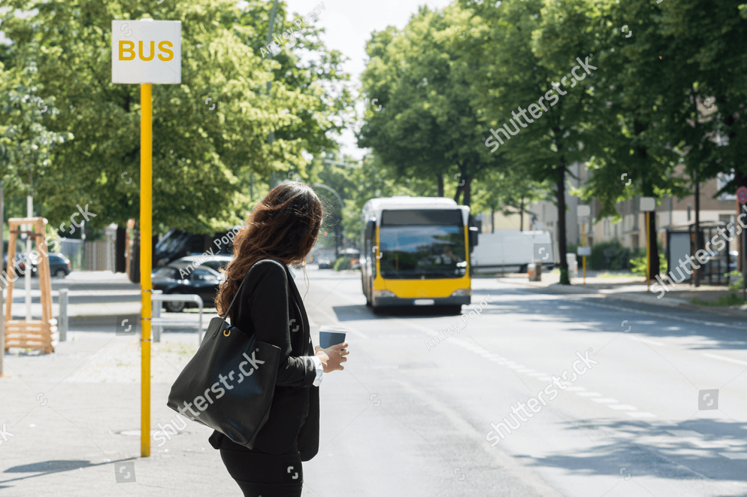 Home (v2) 4 stock photo young businesswoman with disposal cup waiting for bus 471412502 pichi